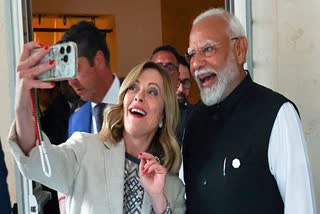 Prime Minister Narendra Modi poses for a selfie with Italian PM Giorgia Meloni on the sidelines of the G7 Outreach Summit, in Apulia on Saturday.
