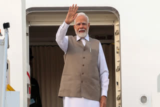 In this image via PMO, Prime Minister Narendra Modi waves as he emplanes for his visit to Cyprus, Canada and Croatia, in New Delhi, Sunday, June 15, 2025.