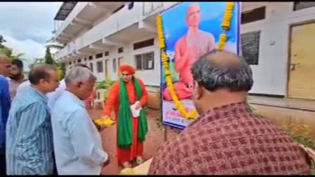 flowers to the portrait of Sri Kamakumar Maharaja