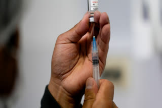 FILE - A healthcare worker prepares a shot of the Pfizer COVID-19 vaccine in La Paz, Bolivia, Jan. 7, 2025.