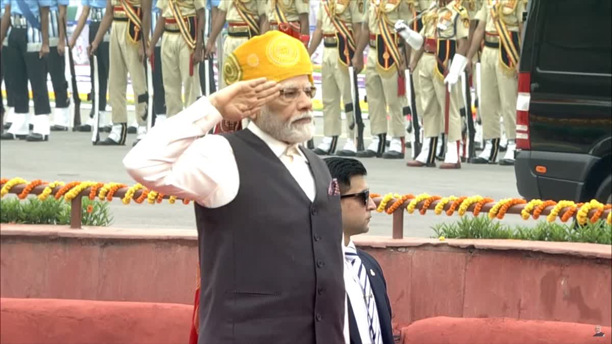 Prime Minister Narendra Modi sported a multicolour Rajasthani bandhani print turban with an off-white kurta and churidar for the 77th Independence Day celebrations at the historic Red Fort.  For his 10th Independence Day speech as prime minister, Modi also wore a black V-neck jacket with the turban which was a mix of yellow, green and red colour with a long tail.