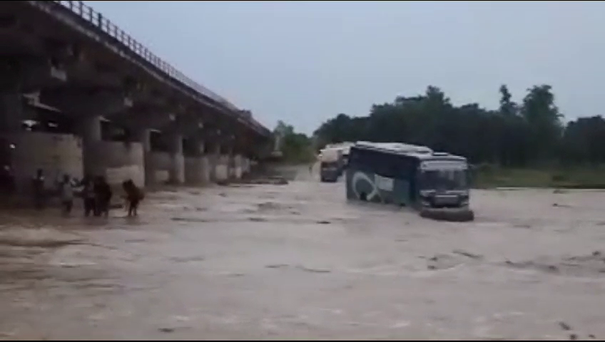 Bus stuck in river