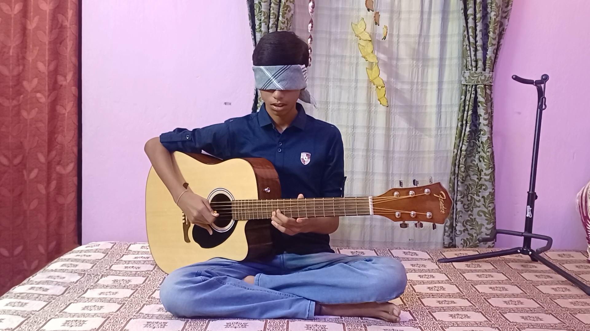 teenager-playing-guitar-blindfolded-in-west-bengal-enters-asia-book-of-records