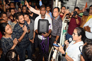 West Bengal Chief Minister Mamata Banerjee speaks to the delegation of junior doctors, who are protesting over the RG Kar rape and murder case, regarding their meeting, outside her residence, in Kolkata on Saturday.