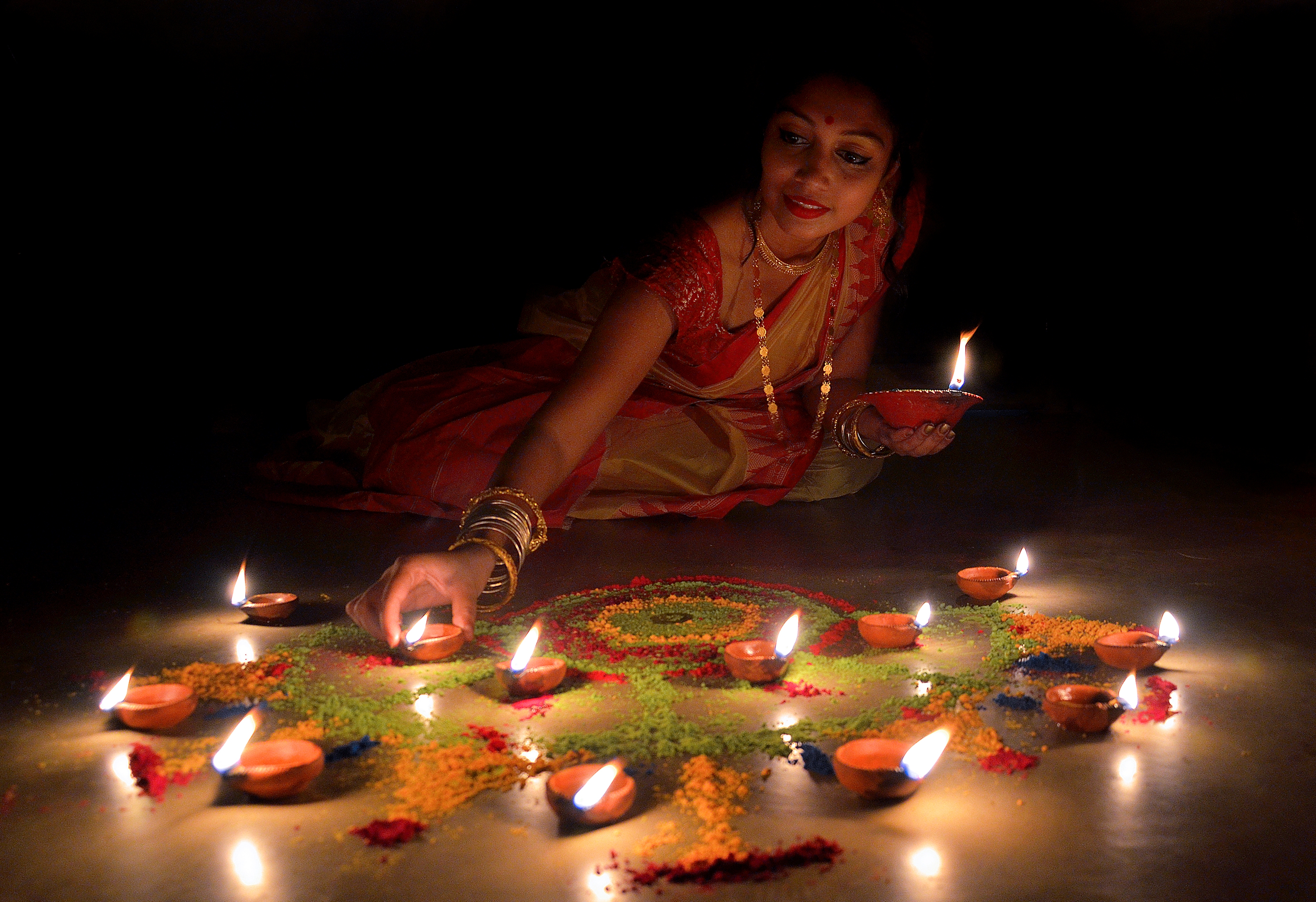 Creating a rangoli at your entrance is a timeless Diwali tradition.