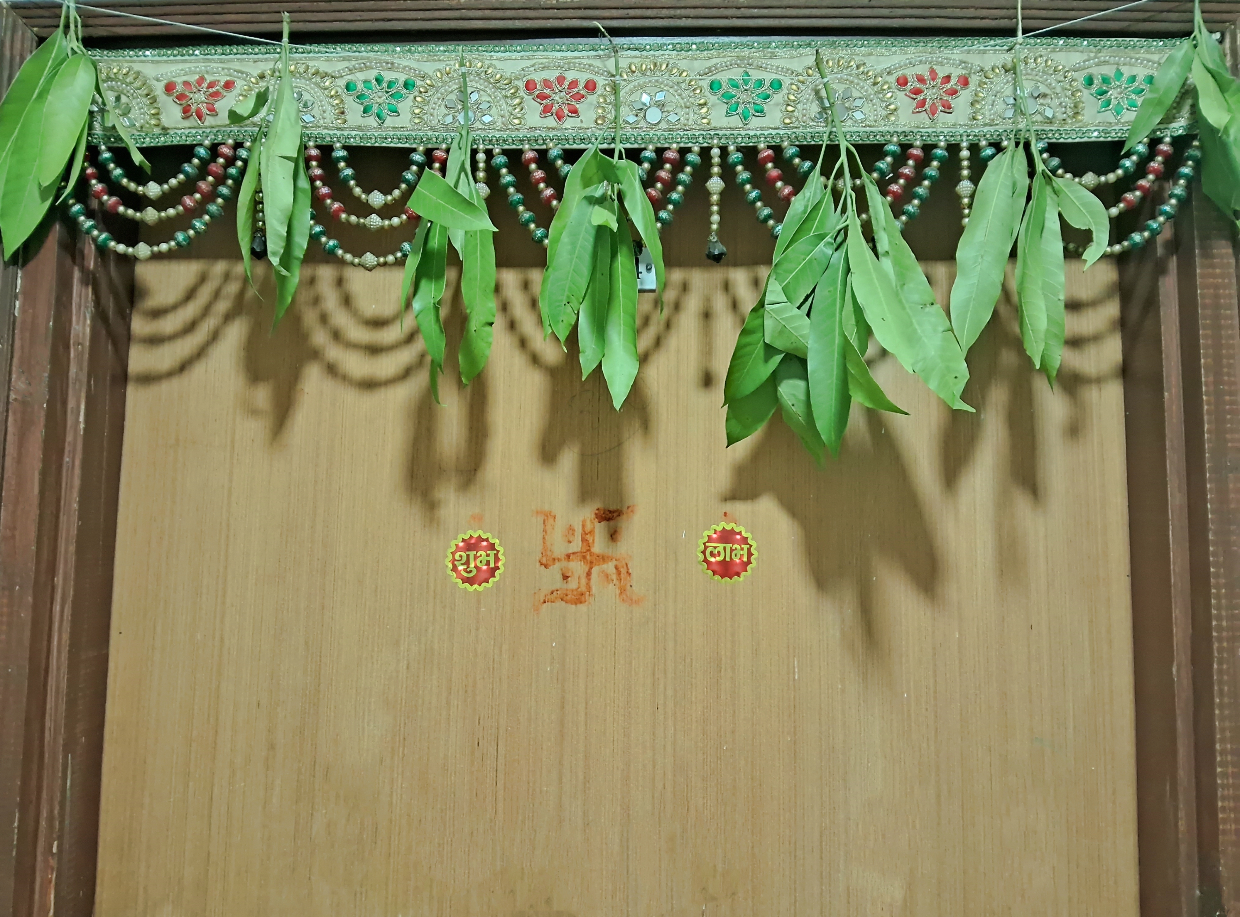 Decorative torans or hanging garlands for the main door are quintessential for Diwali.