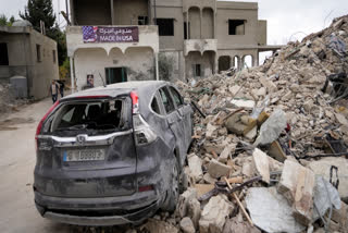 A car sits on the rubble of a building damaged in an Israeli airstrike, in Maisara near the northern coastal town of Byblos, Lebanon, Monday, Oct. 14, 2024.