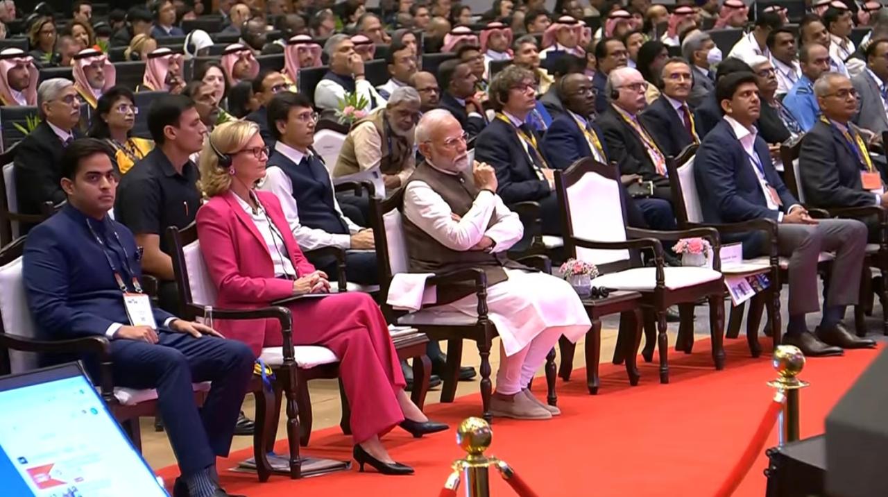 Prime Minister Narendra Modi with other delegates at the Indian Mobile Congress 2024