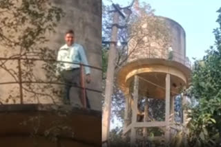 Man climb up on water tank