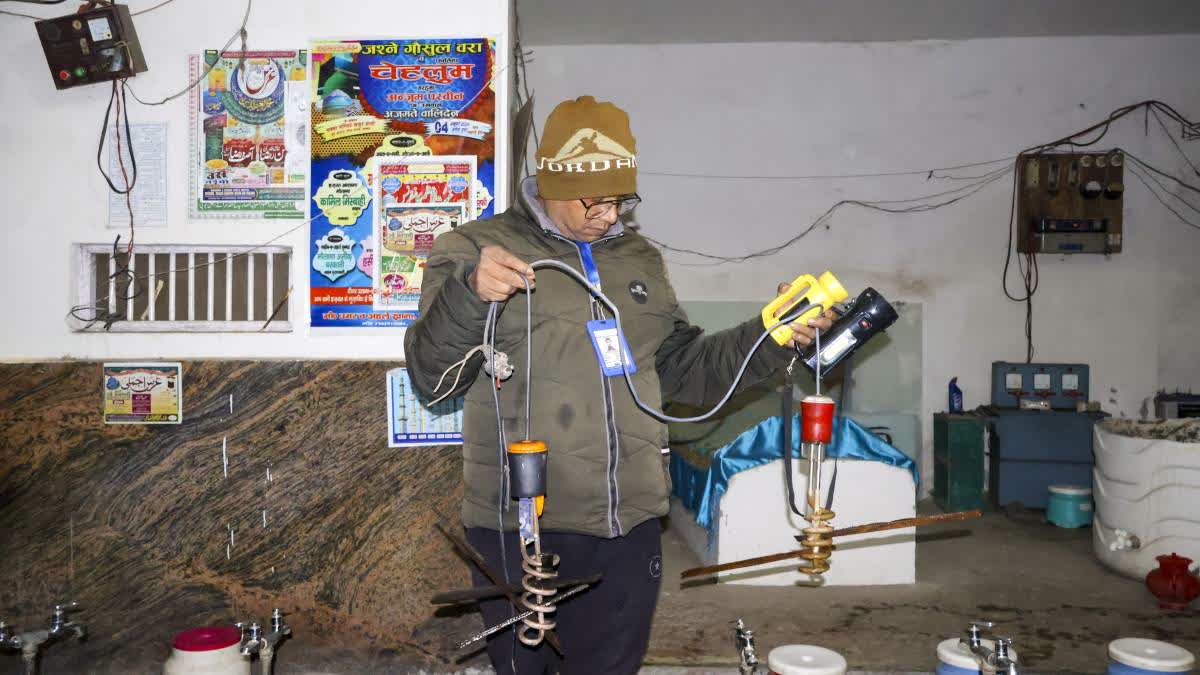 An electricity department official during a crackdown on power theft in Sambhal