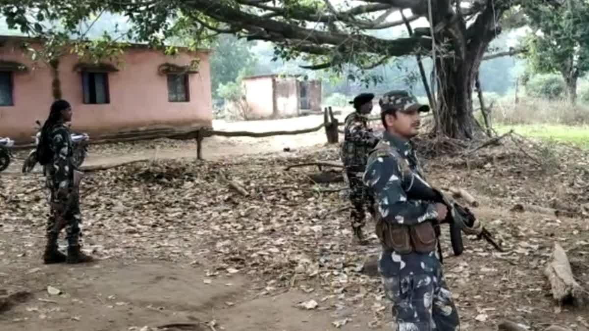 Security forces personnel stand guard in Chaibasa, Jharkhand