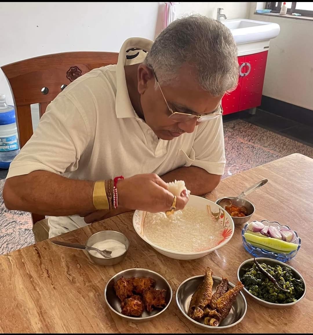 Dilip Ghosh having Pantabhat in summer time