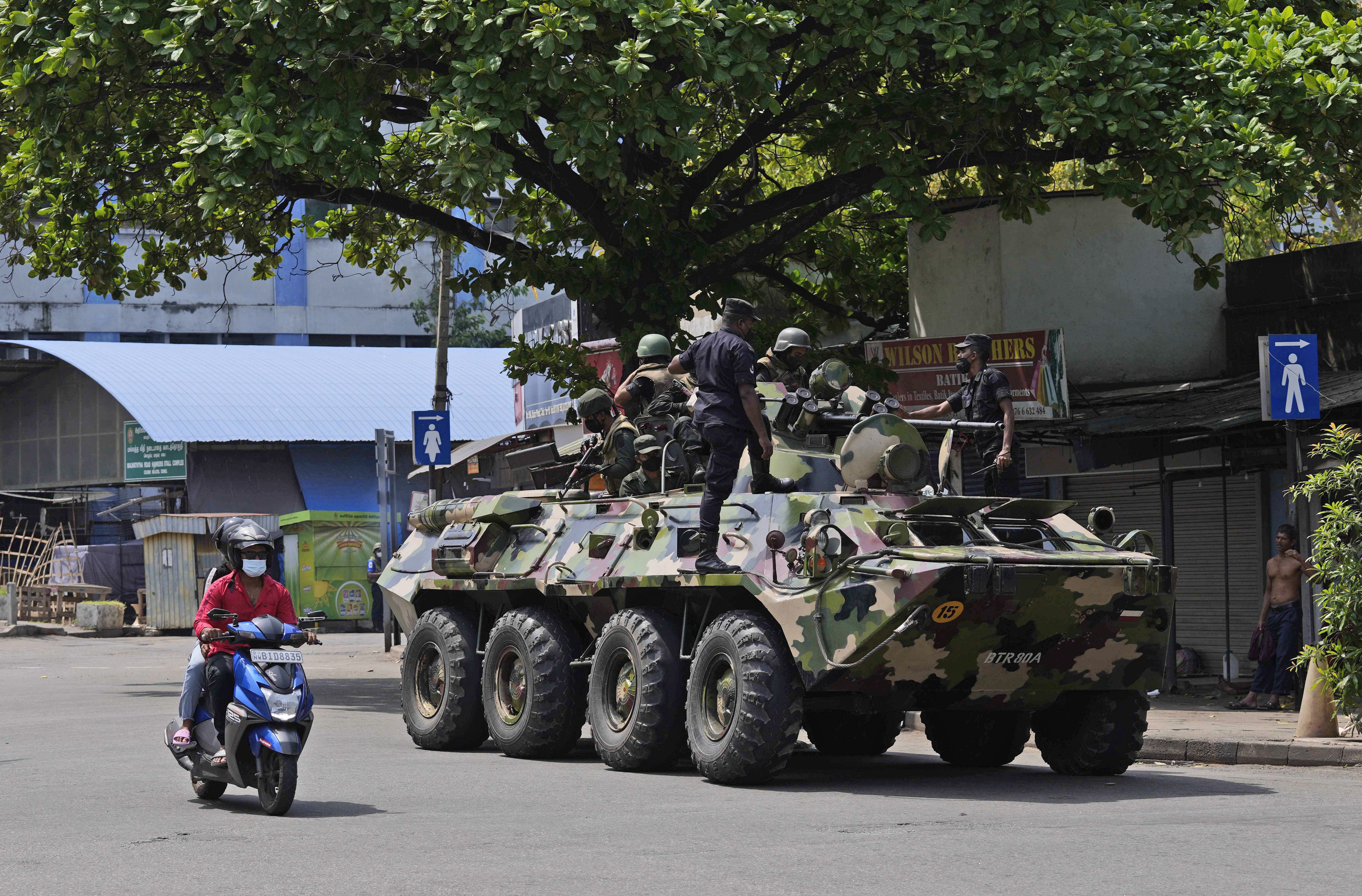 Sri Lankan army soldiers patrol during curfew in Colombo on Wednesday.