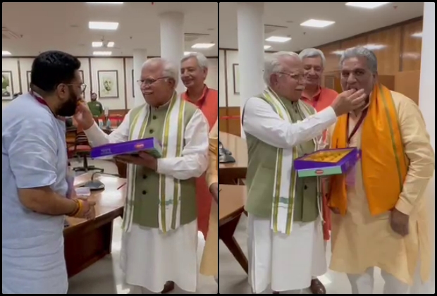 CM Manohar Lal Khattar feeding sweets to Krishna Lal Panwar and Kartikeya Sharma.