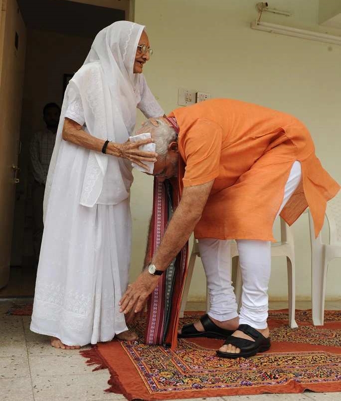 Modi taking blessings from his mother