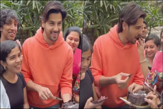 Sidharth Malhotra is all smiles as he cuts birthday cake with fans - watch