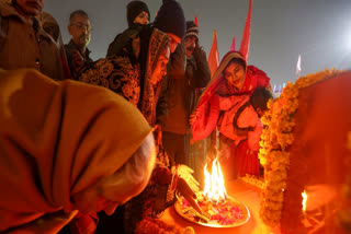 Devotees during an aarti of Shri Panchayati Akhara Bada Udasin during the ongoing Maha Kumbh Mela festival, in Prayagraj, Uttar Pradesh, Wednesday, Jan. 15, 2025.