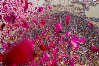 In this image released by UP CMO on Jan. 14, 2025, flower petals being showered on devotees gathered to take a holy dip at Sangam on the occasion of 'Makar Sankranti' during the Maha Kumbh Mela 2025, in Prayagraj, Uttar Pradesh.