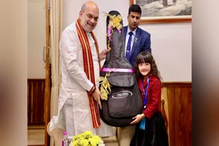 Amit Shah gifts guitar to 7-year-old prodigy from Mizoram