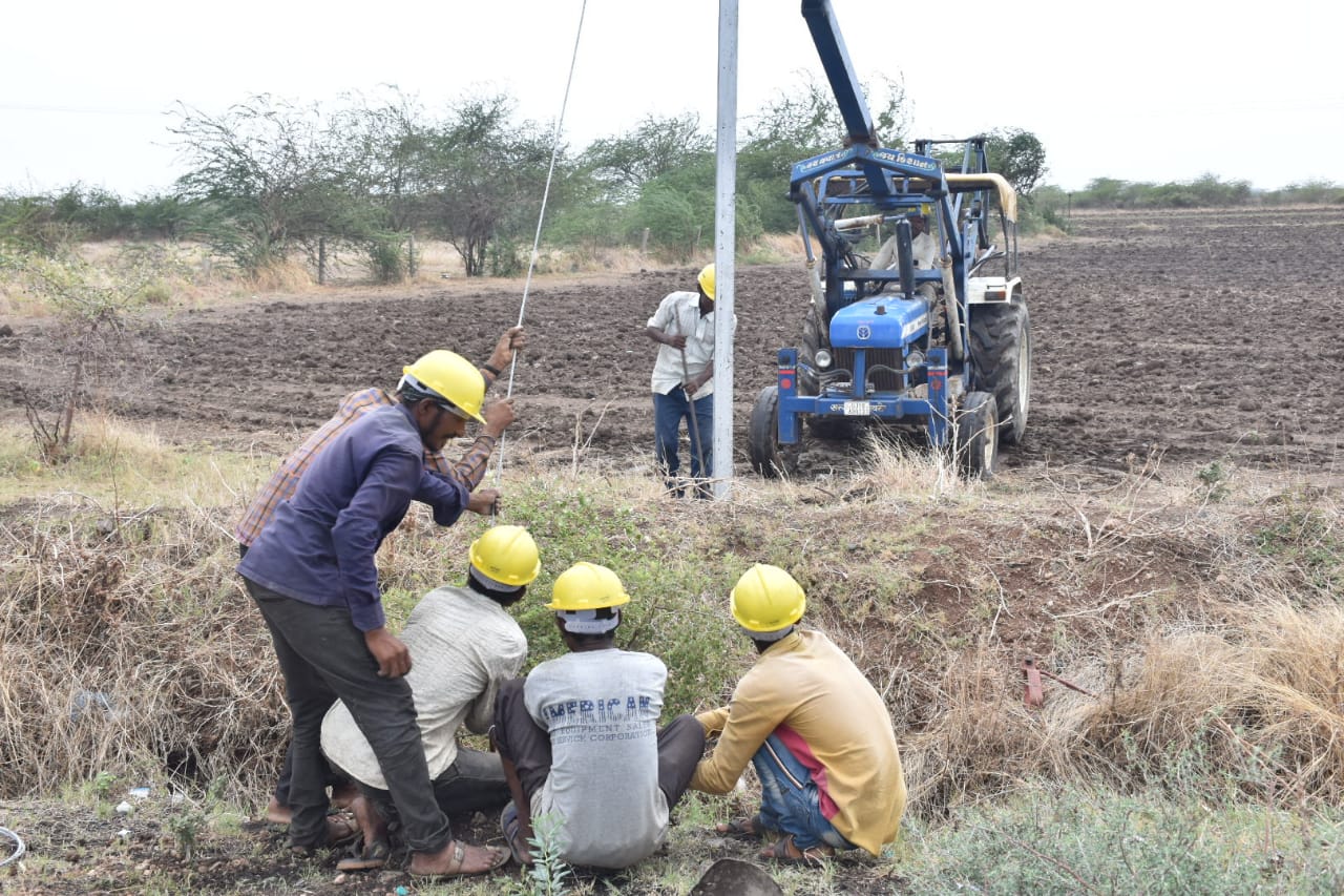 worker repairing electric pole