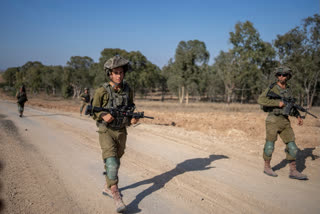 Israeli soldiers are seen near the Gaza Strip border in southern Israel, on Thursday, June 13, 2024.