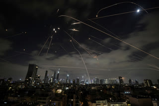 The Israeli Iron Dome air defense system fires to intercept missiles during an Iranian attack over Tel Aviv, Israel, Sunday, June 15, 2025.