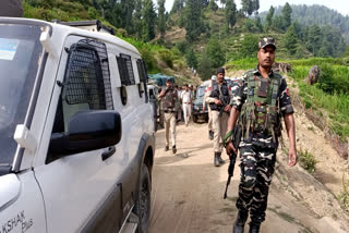 Security personnel conduct a search operation following the recent encounter that broke out between terrorists and security forces, in Doda.