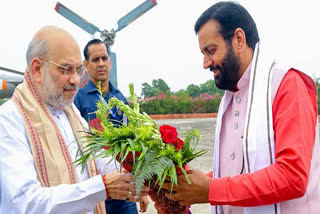 Haryana CM Nayab Saini welcomes Union Home Minister Amit Shah on his arrival, in Mahendragarh on Tuesday.
