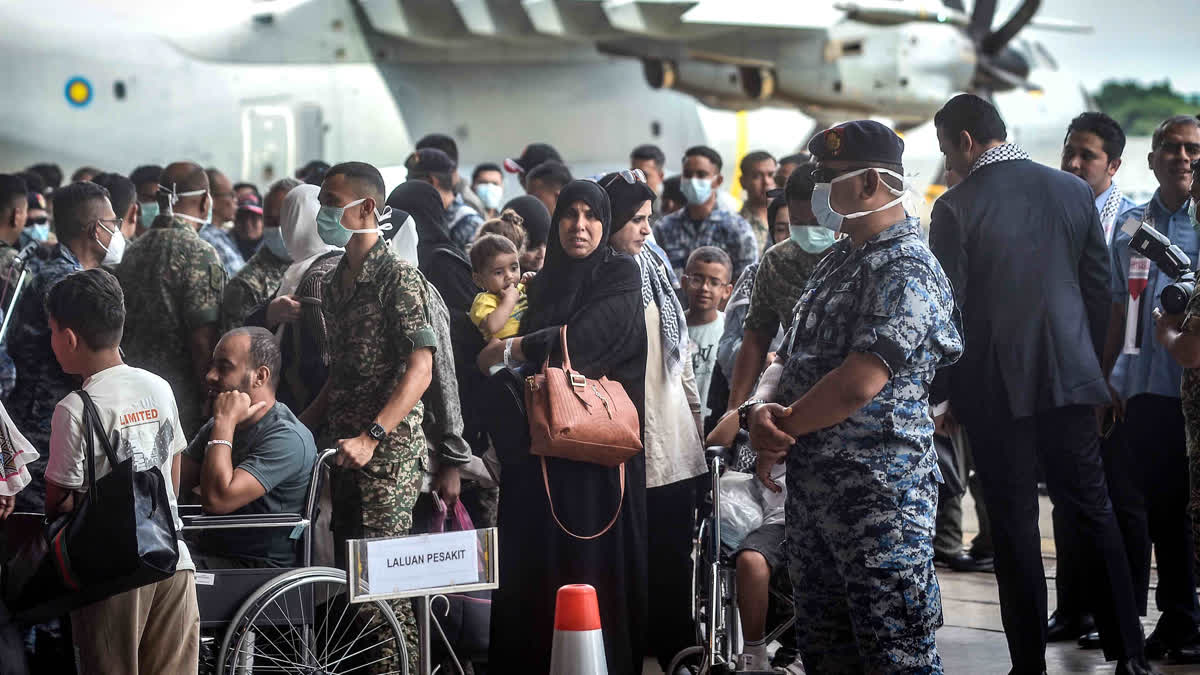 Palestinians injured in Gaza arrive in Malaysia after being flown from Egypt to receive medical treatment, at the Malaysian Air Force base in Subang on August 16, 2024, amid the ongoing war between Israel and the Palestinian Hamas movement in the Gaza Strip.