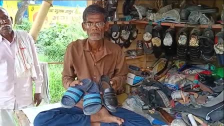 Sultanpur Cobbler Ramchet shows chappals and a shoe repaired by Rahul Gandhi