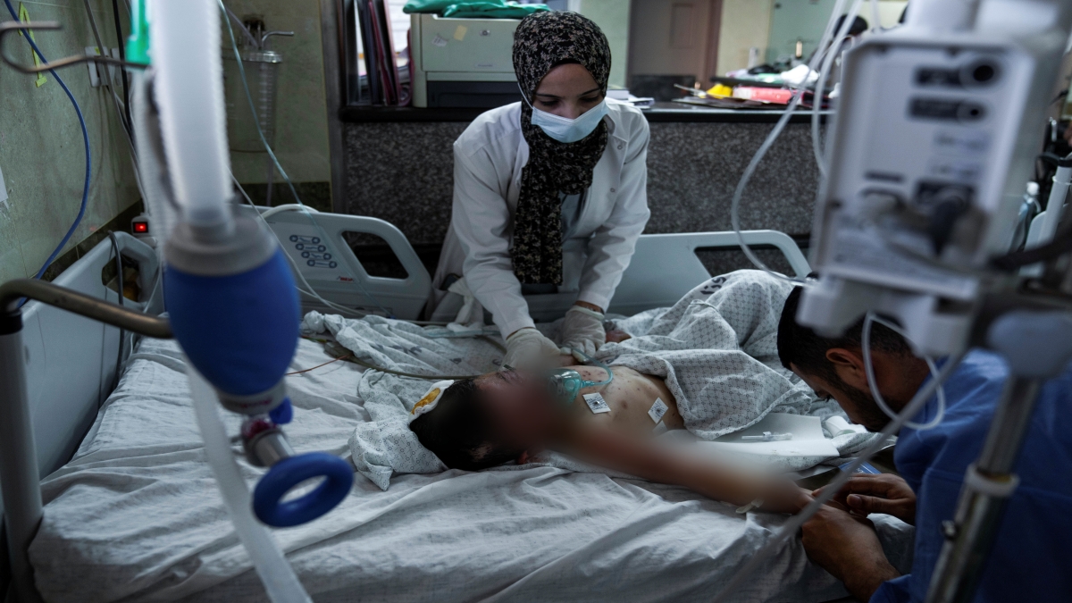 A Palestinian boy wounded during an Israeli airstrike receives medical treatment at Nasser Hospital in Khan Younis, Gaza Strip, Sunday, Oct. 15, 2023. (AP Photo/Fatima Shbair)