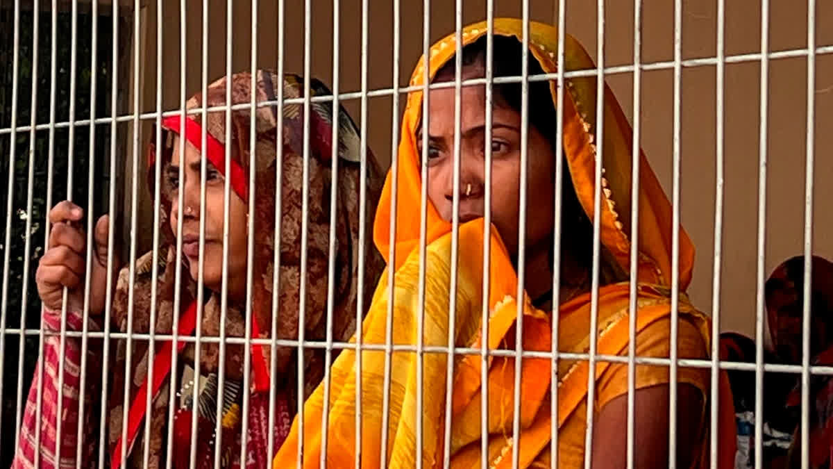 Family members wait outside the emergency ward on Saturday, a day after fire broke out in the NICU of Maharani Laxmi Bai Medical College in Jhansi district.