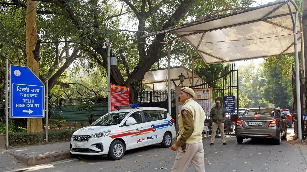 Police personnel stand outside Delhi High Court.