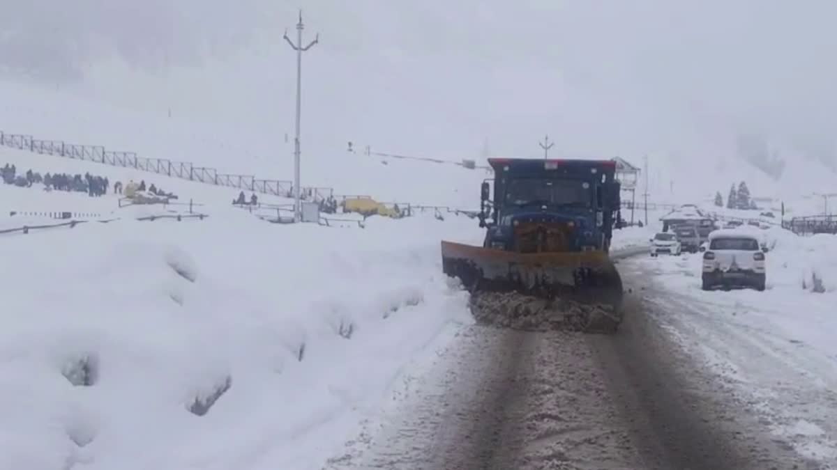 A snow clearance machine in action after fresh snowfall in Ganderbal, Kashmir