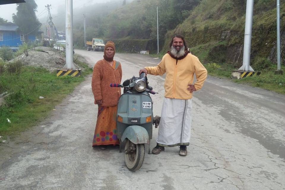 Man takes mother on pilgrimage on old  Scooter