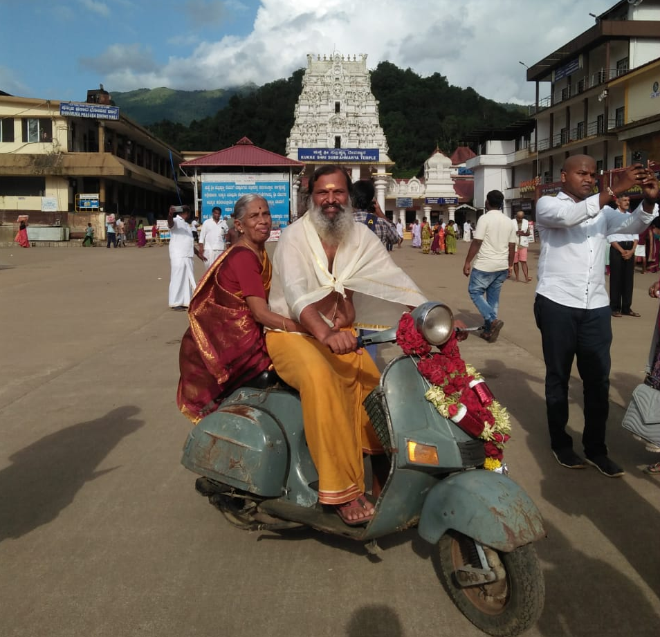 Man takes mother on pilgrimage on old  Scooter
