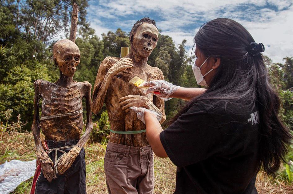 Indonesian villagers pull out and dress bodies to perform Afterlife Ritual