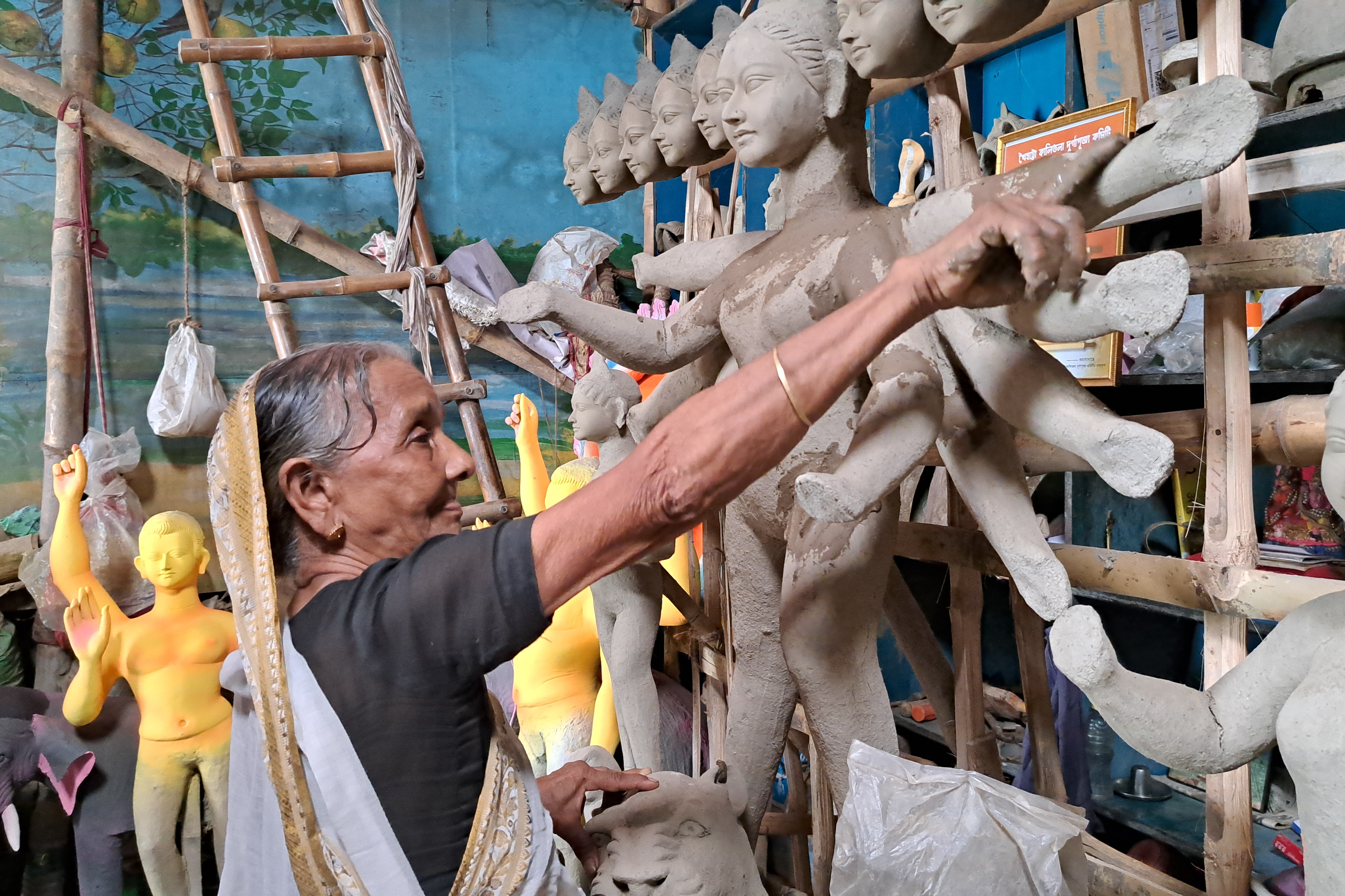 90-year-old woman makes Durga idol to help her son in Malda