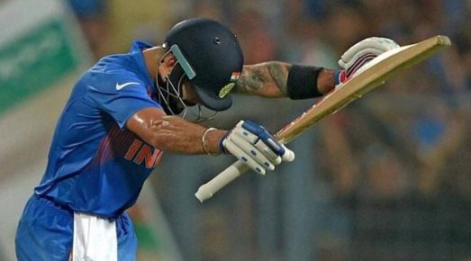 Virat Kohli bows to Sachin Tendulkar in the stands after finishing his half-century against Pakistan at Eden Gardens in Kolkata.