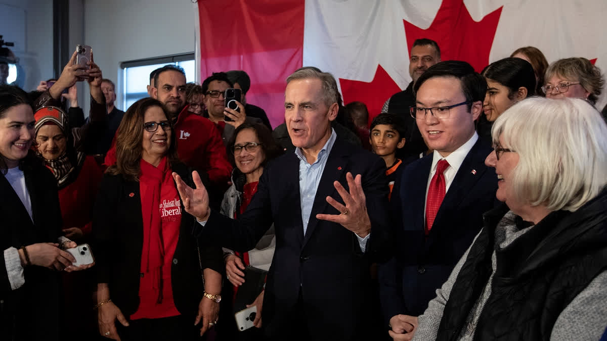 Mark Carney talks with supporters during his Liberal leadership campaign launch in Edmonton, on Thursday Jan. 16, 2025.