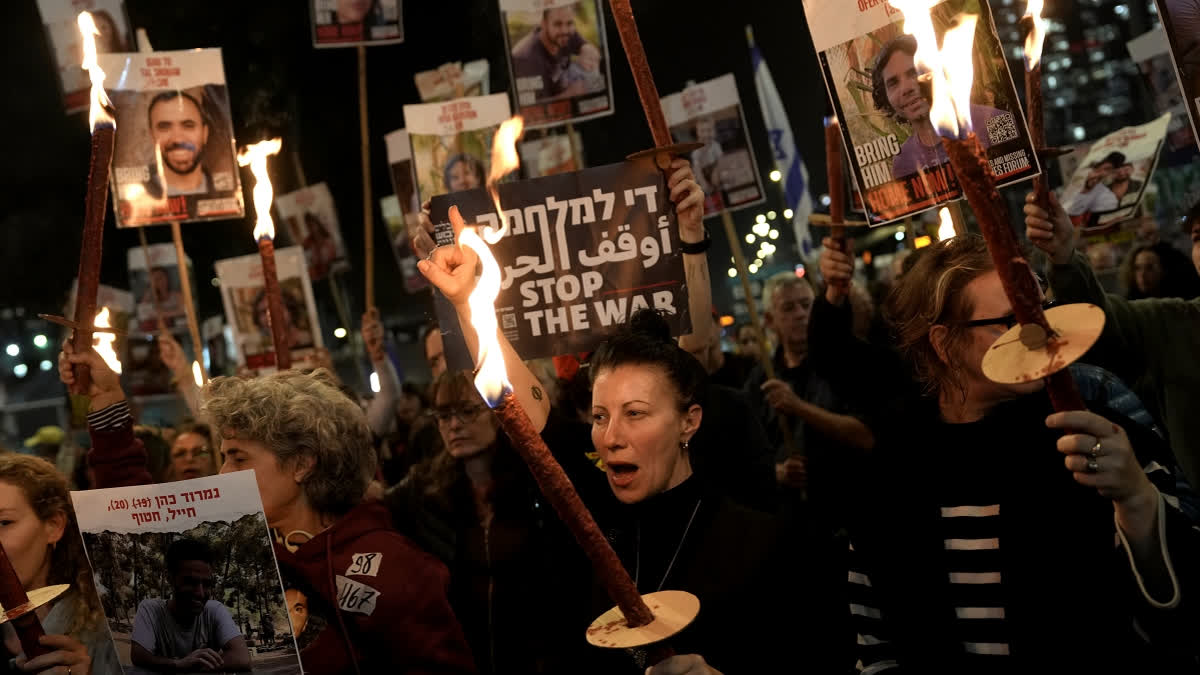 Relatives and friends of people killed and abducted by Hamas and taken into Gaza, react to the ceasefire announcement as they take part in a demonstration in Tel Aviv, Israel, Wednesday, Jan. 15, 2025.