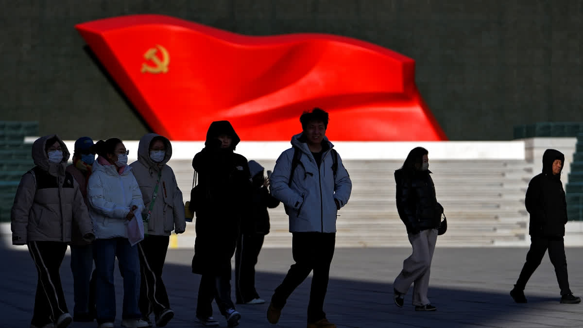 People walk past a sculpture of the Chinese Communist Party flag at the Museum of the Communist Party of China, in Beijing on Jan. 14, 2025.