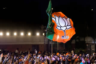 BJP workers gather to celebrate the party's win in the Delhi Assembly election, at the party HQ in New Delhi on Saturday