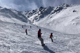 Skiers in action at ski destination Gulmarg