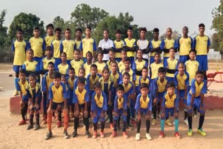 Children footballers pose for a group photograph at Vicharpur village of Shahdol, Madhya Pradesh