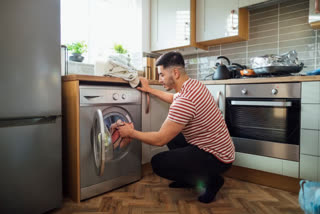In which direction should the washing machine be placed in the house according to Vastu?