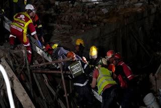 A rescue operation at apartment collapse site in South Africa.
