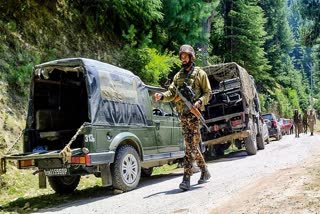 Army personnel stand guard near the site where the encounter took place between security forces and terrorists, in Doda on Tuesday. Four soldiers including an Army Captain lost lives in the encounter.