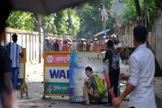 Police have fired tear gas and charged with batons overnight during violent clashes between a pro-government student body and student protesters, leaving dozens injured at a leading public university outside Bangladesh's capital over quota system in government jobs, police and students said Tuesday.