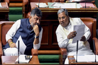 Karnataka CM Siddaramaiah, right, with Deputy CM DK Shivakumar in State Assembly in Bengaluru.